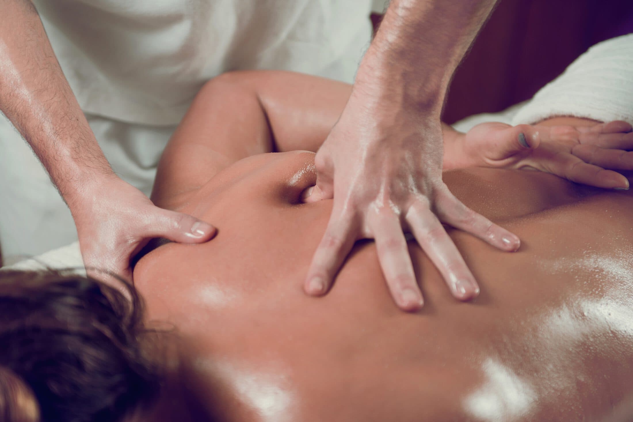 Massage treatment focusing on the upper back, neck, and shoulders