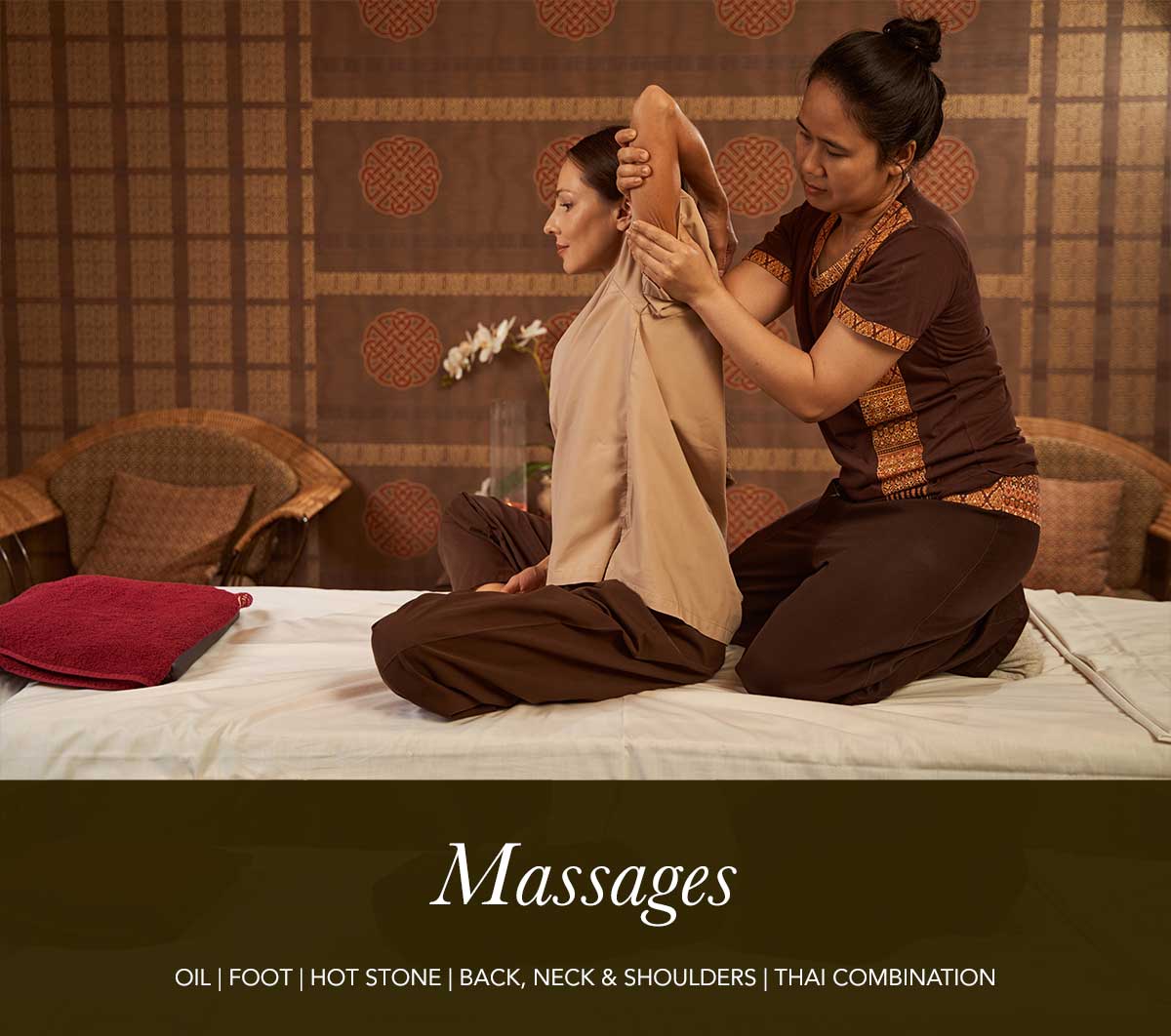 Lady performing Thai massage on a young lady